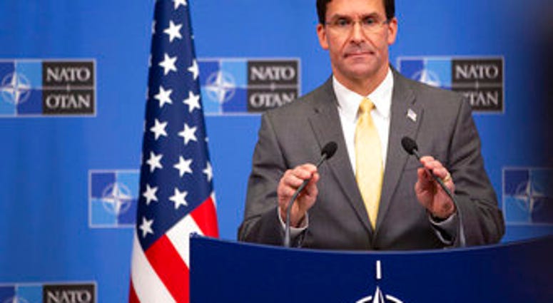 U.S. Secretary for Defense Mark Esper speaks during a media conference after a meeting of NATO defense ministers at NATO headquarters in Brussels, Friday, Oct. 25, 2019. (AP Photo/Virginia Mayo)