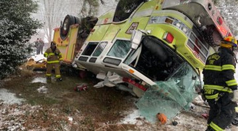 Henrico Fire Truck flips on snowy Woodman Road. (Henrico Fire) Henrico Fire Truck flips on snowy Woodman Road. (Henrico Fire)