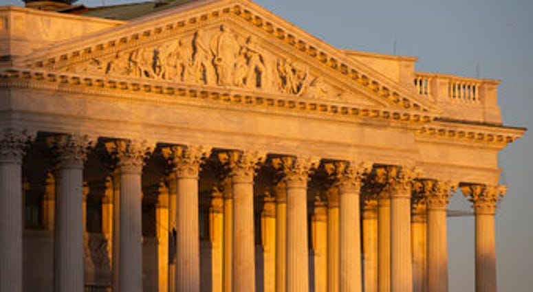 The Senate side of the U.S. Capitol at sunrise on Monday, Jan. 20, 2020, in Washington. The impeachment trial of President Donald Trump will resume in the U.S. Senate on Tuesday. (AP Photo/Jon Elswick) The Senate side of the U.S. Capitol at sunrise on Monday, Jan. 20, 2020, in Washington. The impeachment trial of President Donald Trump will resume in the U.S. Senate on Tuesday. (AP Photo/Jon Elswick)