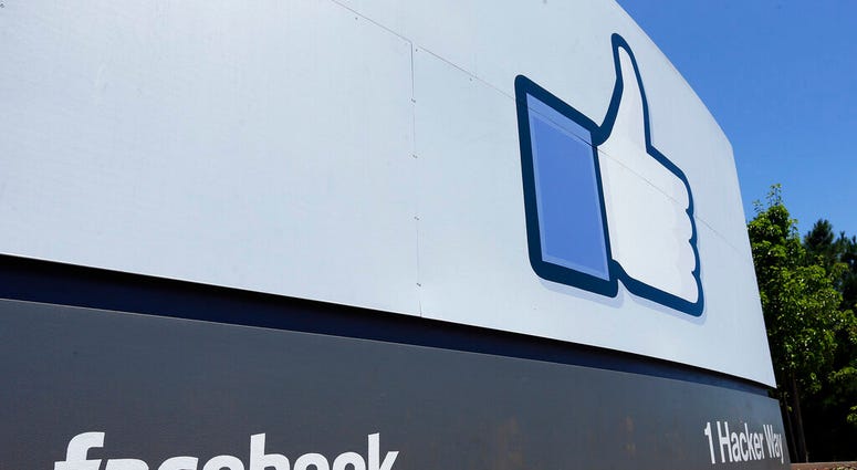FILE - This July 16, 2013 file photo shows a sign at Facebook headquarters in Menlo Park, Calif. Facebook said in a Thursday, May 23, 2019 report, it removed more than 3 billion fake accounts. (AP Photo/Ben Margot, File)