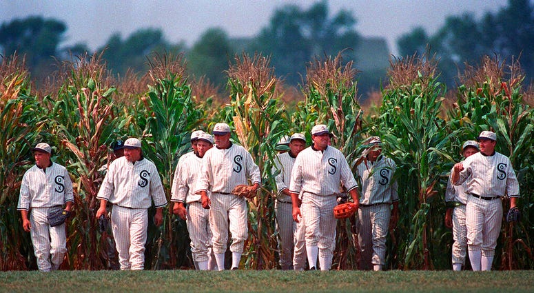 FILE - In this file photo, people portraying ghost players emerge from a cornfield as they reenact a scene from the movie "Field of Dreams" at the movie site in Dyersville, Iowa. (AP Photo/Charlie Neibergall, File)