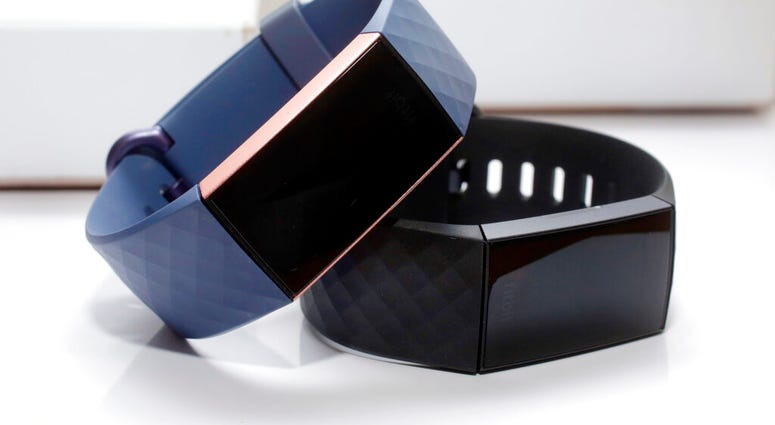 FILE - In this Aug. 16, 2018, file photo, the Fitbit Charge 3 fitness trackers are displayed in New York. Google’s parent company is buying wearable device maker Fitbit for about $2.1 billion. (AP Photo/Richard Drew, File)