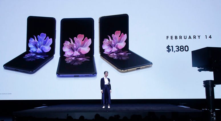 Rebecca Hirst, head of UK Mobile Product Development, speaks in front of photos of Samsung Galaxy Z Flip Phones at the Unpacked 2020 event in San Francisco, Tuesday, Feb. 11, 2020. (AP Photo/Jeff Chiu) Rebecca Hirst, head of UK Mobile Product Development, speaks in front of photos of Samsung Galaxy Z Flip Phones at the Unpacked 2020 event in San Francisco, Tuesday, Feb. 11, 2020. (AP Photo/Jeff Chiu)