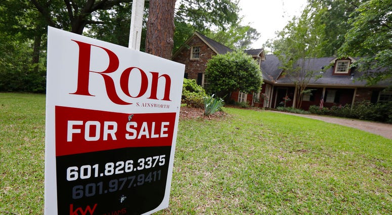 FILE- In this April 23, 2018, file photo a for sale sign sits in front of a home in Jackson, Miss. On Thursday, May 24, Freddie Mac reports on the week’s average U.S. mortgage rates. (AP Photo/Rogelio V. Solis, File)