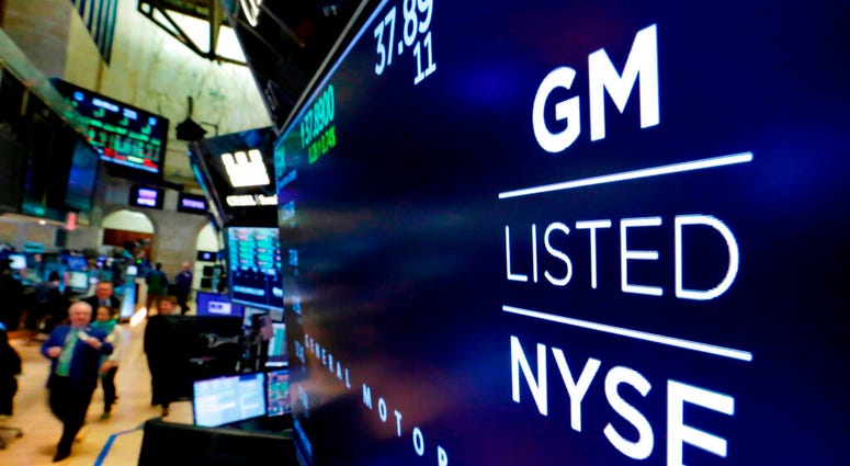 FILE - In this April 23, 2018, file photo, the logo for General Motors appears above a trading post on the floor of the New York Stock Exchange. (AP Photo/Richard Drew, File) FILE - In this April 23, 2018, file photo, the logo for General Motors appears above a trading post on the floor of the New York Stock Exchange. (AP Photo/Richard Drew, File)