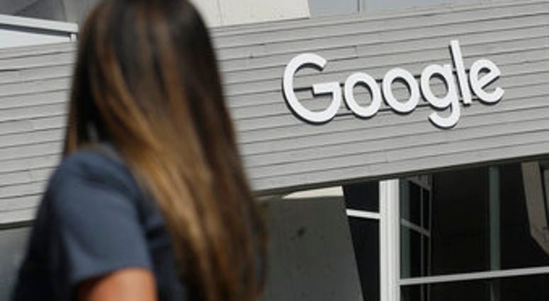 FILE - In this Sept. 24, 2019, file photo, a woman walks below a Google sign on the campus in Mountain View, Calif. New Mexico is suing Google over allegations that the tech company is illegally collecting personal data. (AP Photo/Jeff Chiu, File) FILE - In this Sept. 24, 2019, file photo, a woman walks below a Google sign on the campus in Mountain View, Calif. New Mexico is suing Google over allegations that the tech company is illegally collecting personal data. (AP Photo/Jeff Chiu, File)