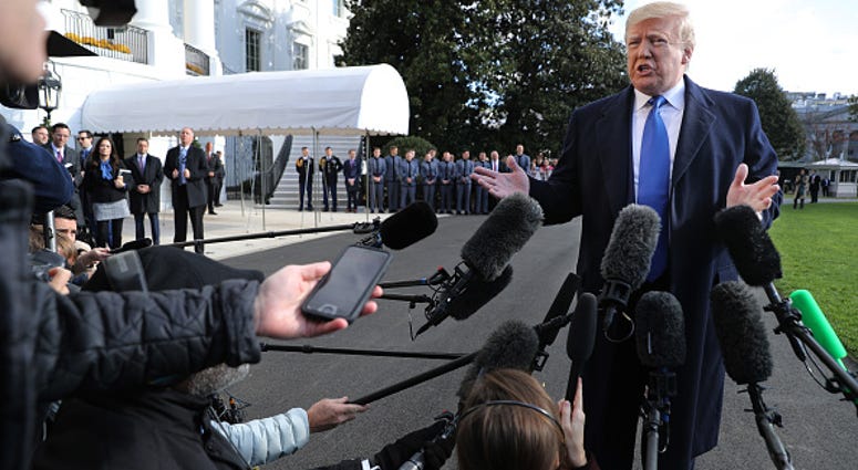 President Donald Trump reporters