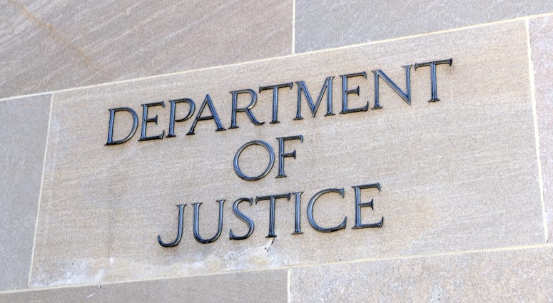 Department of Justice sign, Washington DC, USA.