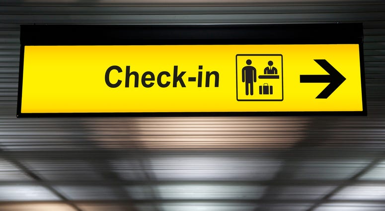 check in information sign at the airport.