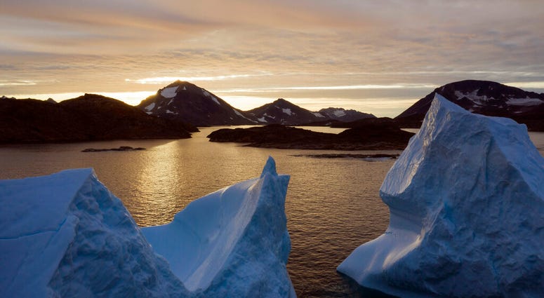 An aerial view of large Icebergs floating as the sun rises near Kulusuk, Greenland, early Aug. 16, 2019. Greenland has been melting faster in the last decade and this summer, it has seen two of the biggest melts on record since 2012. (AP Photo/Felipe Dana