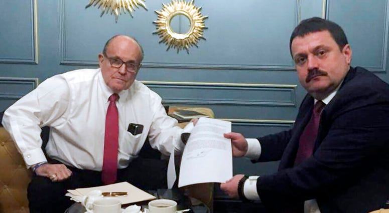 In this handout photo provided by Adriii Derkach's press office, Rudy Giuliani, an attorney for U.S President Donald Trump, left, meets with Ukrainian lawmaker Adriii Derkach in Kyiv, Ukraine, Thursday, Dec. 5, 2019. (Adriii Derkach's press office via AP) In this handout photo provided by Adriii Derkach's press office, Rudy Giuliani, an attorney for U.S President Donald Trump, left, meets with Ukrainian lawmaker Adriii Derkach in Kyiv, Ukraine, Thursday, Dec. 5, 2019. (Adriii Derkach's press office via AP)