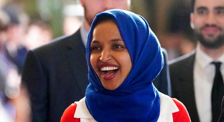 In this Feb. 5, 2019 photo, Rep. Ilhan Omar, D-Minn., arrives for President Donald Trump's State of the Union address to a joint session of Congress on Capitol Hill in Washington. (AP Photo/Carolyn Kaster)