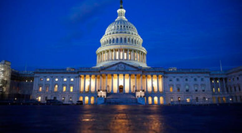 FILE - In this Dec. 4, 2019, file photo, fight shines on the U.S. Capitol dome in Washington. (AP Photo/Patrick Semansky, File) FILE - In this Dec. 4, 2019, file photo, fight shines on the U.S. Capitol dome in Washington. (AP Photo/Patrick Semansky, File)
