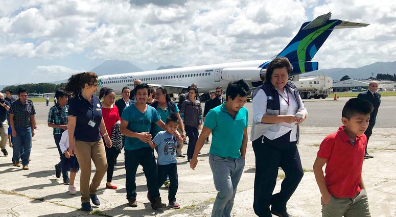 Families separated under President Donald Trump administration’s zero tolerance policy return home to Guatemala City, Guatemala, Tuesday, July 10, 2018, after being deported from the United States. (AP Photo/Colleen Long)