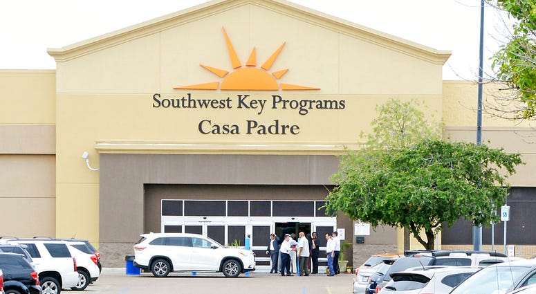 FILE - In this June 18, 2018 file photo, dignitaries take a tour of Southwest Key Programs Casa Padre, a U.S. immigration facility in Brownsville, Texas, where children who have been separated from their families are detained. The American Civil Liberties
