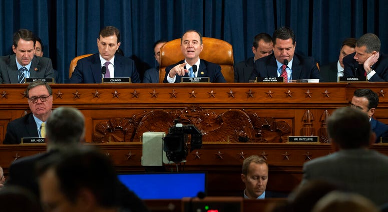 House Intelligence Committee Chairman Adam Schiff of Calif., center, speaks during the House Intelligence Committee on Capitol Hill in Washington, Wednesday, Nov. 13, 2019. (Saul Loeb/Pool Photo via AP)