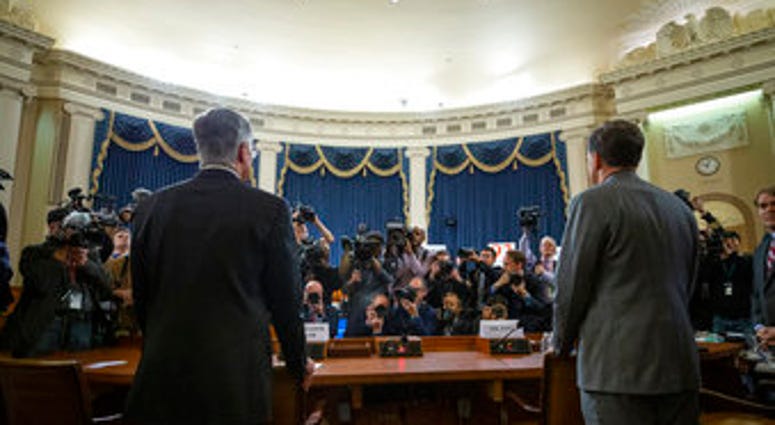 Top U.S. diplomat in Ukraine William Taylor, left, and career Foreign Service officer George Kent arrive to testify during an impeachment hearing of the House Intelligence Committee on Capitol Hill. (AP Photo/Alex Brandon)