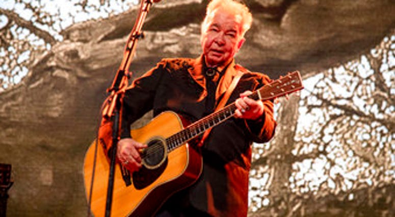 FILE - This June 15, 2019 file photo shows John Prine performing at the Bonnaroo Music and Arts Festival in Manchester, Tenn. Prine died Tuesday, April 7, 2020, from complications of the coronavirus. He was 73. (Photo by Amy Harris/Invision/AP, File) FILE - This June 15, 2019 file photo shows John Prine performing at the Bonnaroo Music and Arts Festival in Manchester, Tenn. Prine died Tuesday, April 7, 2020, from complications of the coronavirus. He was 73. (Photo by Amy Harris/Invision/AP, File)