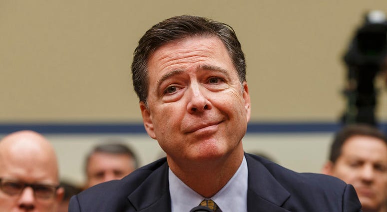 In this file July 7, 2016, photo then-FBI Director James Comey testifies before the House Oversight Committee to discuss Hillary Clinton's email investigation, at the Capitol in Washington. (AP Photo/J. Scott Applewhite, File)