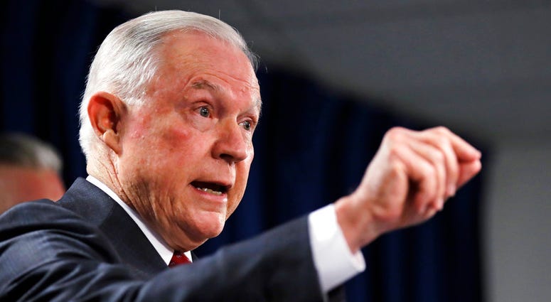 U.S. Attorney General Jeff Sessions gestures during a news conference at the Moakley Federal Building in Boston, Thursday, July 26, 2018. Sessions is defending his top deputy after some Congressional Republicans moved to impeach him. Sessions said Thursda