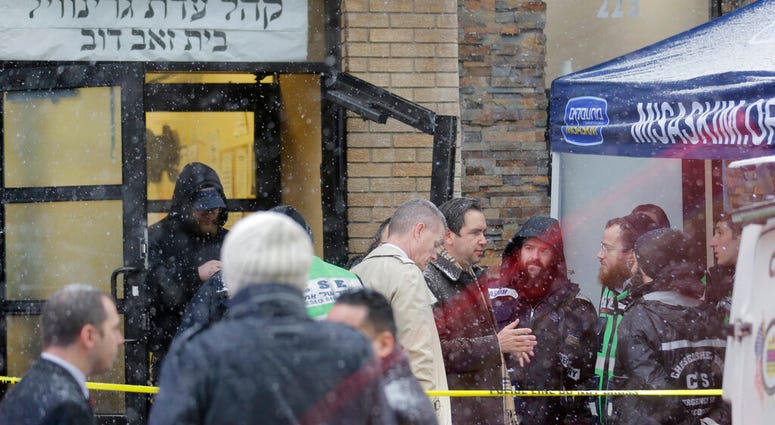 Jersey City's mayor Steven Fulop, center right, talks with first responders at the scene of a shooting in Jersey City, N.J., Dec. 11, 2019. Fulop says gunmen targeted a kosher market during a shooting that killed multiple people. (AP Photo/Seth Wenig) Jersey City's mayor Steven Fulop, center right, talks with first responders at the scene of a shooting in Jersey City, N.J., Dec. 11, 2019. Fulop says gunmen targeted a kosher market during a shooting that killed multiple people. (AP Photo/Seth Wenig)