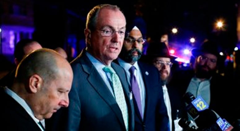 New Jersey Gov. Phil Murphy speaks with media near the scene following reports of gunfire, Tuesday, Dec. 10, 2019, in Jersey City, N.J. (AP Photo/Eduardo Munoz Alvarez) New Jersey Gov. Phil Murphy speaks with media near the scene following reports of gunfire, Tuesday, Dec. 10, 2019, in Jersey City, N.J. (AP Photo/Eduardo Munoz Alvarez)