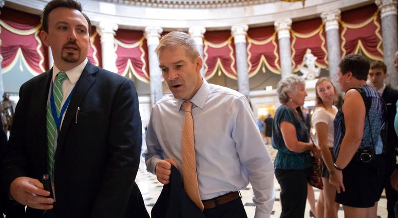 Rep. Jim Jordan, R-Ohio, walks to the House chamber as he prepares to file articles of impeachment against Deputy Attorney General Rod J. Rosenstein, on Capitol Hill in Washington, Thursday, July 26, 2018. (AP Photo/J. Scott Applewhite)