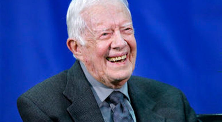 In this Sept. 18, 2018 file photo, former President Jimmy Carter answers questions from students during his annual town hall with Emory University freshman in the campus gym in Atlanta. (Curtis Compton/Atlanta Journal-Constitution via AP, File)