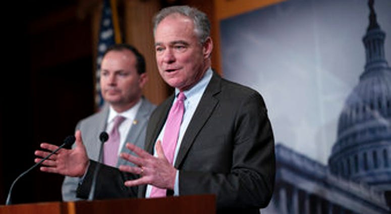 Sen. Tim Kaine, joined at left by Sen. Mike Lee, just after the Senate advanced a resolution asserting that President Trump must seek approval from Congress before engaging in further military action against Iran. (AP Photo/J. Scott Applewhite) Sen. Tim Kaine, joined at left by Sen. Mike Lee, just after the Senate advanced a resolution asserting that President Trump must seek approval from Congress before engaging in further military action against Iran. (AP Photo/J. Scott Applewhite)