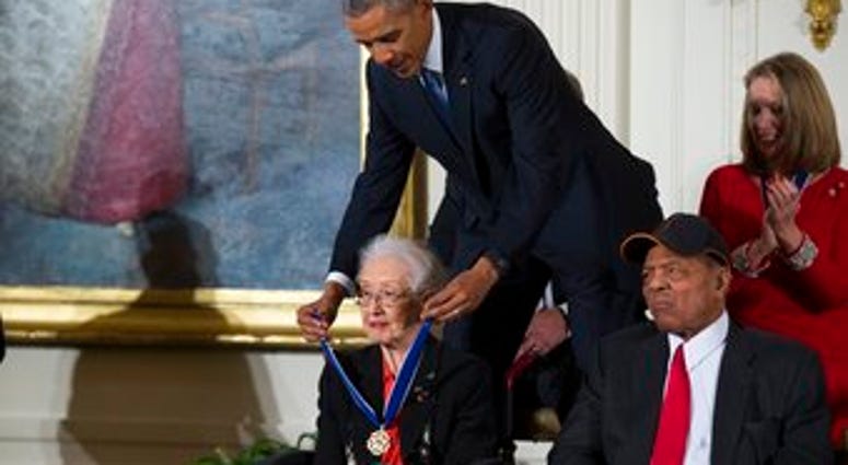 FILE - In this Nov. 24, 2015 photo, Willie Mays, right, looks on as President Barack Obama presents the Presidential Medal of Freedom to NASA mathematician Katherine Johnson during a ceremony at the White House. (AP Photo/Evan Vucci, File) FILE - In this Nov. 24, 2015 photo, Willie Mays, right, looks on as President Barack Obama presents the Presidential Medal of Freedom to NASA mathematician Katherine Johnson during a ceremony at the White House. (AP Photo/Evan Vucci, File)