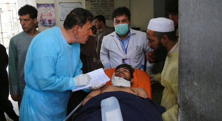 A wounded man receives treatment at a hospital after an explosion in Kabul, Afghanistan, Wednesday, Aug. 7, 2019. (AP Photo/Rafiq Maqbool)