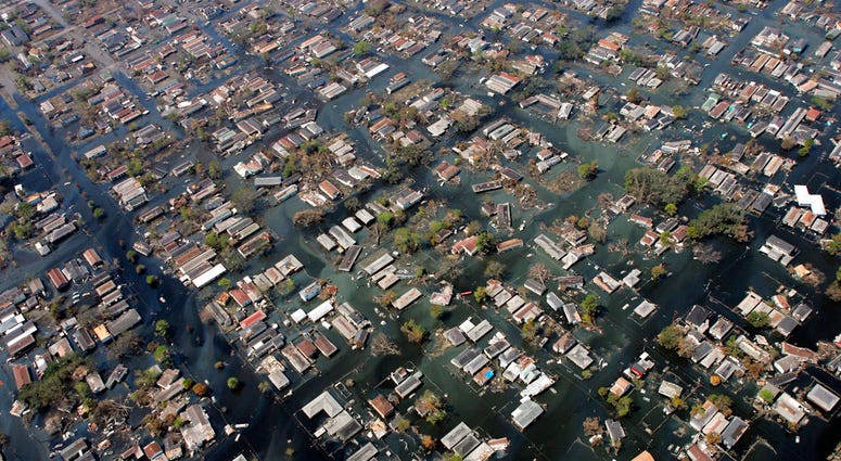 FILE - In this Sept. 11, 2005, file photo, homes remain surrounded by floodwaters in the aftermath of Hurricane Katrina in New Orleans. Some experts are concerned that Hurricane Florence could inflict damage comparable to 2005’s Hurricane Katrina in a par