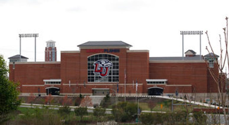 Liberty University's football stadium is empty as students were welcomed back to the university's campus, Tuesday March 24 , 2020, in Lynchburg, Va. (AP Photo/Steve Helber) Liberty University's football stadium is empty as students were welcomed back to the university's campus, Tuesday March 24 , 2020, in Lynchburg, Va. (AP Photo/Steve Helber)