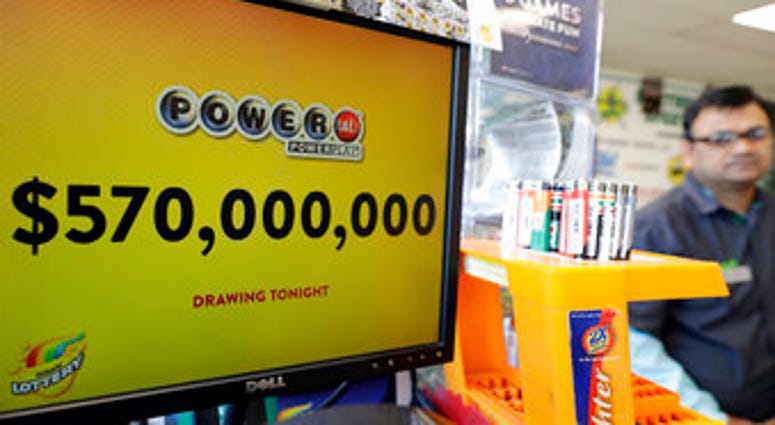 FILE - In this Jan. 6, 2018 file photo, a Powerball lottery sign displays the lottery prizes at a convenience store in Chicago. Lottery jackpots are going to shrink as the coronavirus pandemic tamps down lottery sales. (AP Photo/Nam Y. Huh File) FILE - In this Jan. 6, 2018 file photo, a Powerball lottery sign displays the lottery prizes at a convenience store in Chicago. Lottery jackpots are going to shrink as the coronavirus pandemic tamps down lottery sales. (AP Photo/Nam Y. Huh File)