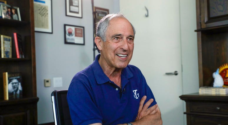 FILE - In this May 3, 2018, file photo, attorney Lanny Davis speaks during an interview with The Associated Press in his K Street office in Washington. President Donald Trump’s longtime personal lawyer and fixer Michael Cohen has Davis, added a close frie