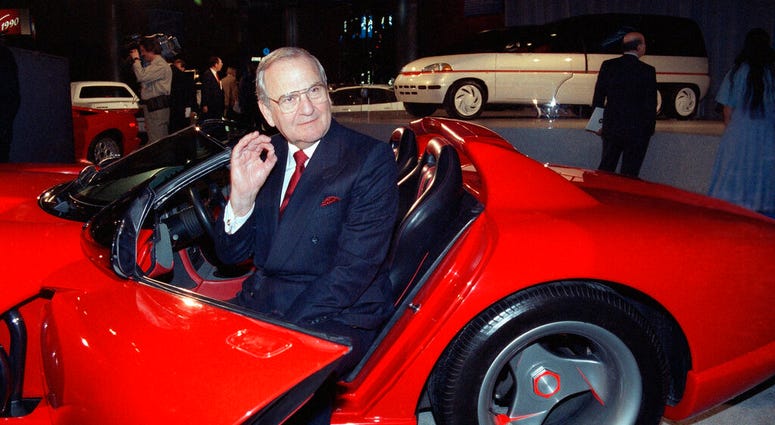 FILE - In this March 28, 1990, file photo, Chrysler Corporation Chairman Lee Iacocca sits in a 1990 Dodge Viper sports car as the Chrysler in the 90's six city tour makes a visit to New York. (AP Photo/Osamu Honda, File)
