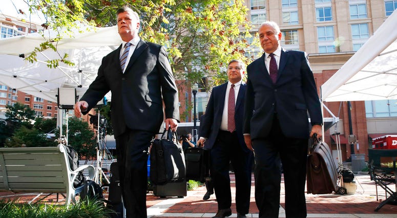 Members of the defense team for Paul Manafort walk to federal court for closing arguments in the trial of the former Trump campaign chairman, in Alexandria, Va., Wednesday, Aug. 15, 2018. (AP Photo/Jacquelyn Martin)