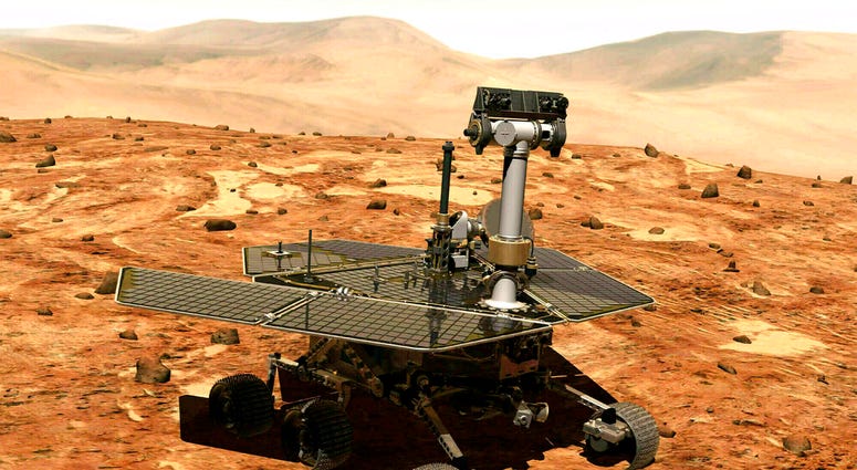 FILE - This illustration made available by NASA shows the rover Opportunity on the surface of Mars. The exploratory vehicle landed on Jan. 24, 2004, and logged more than 28 miles (45 kilometers) before falling silent during a global dust storm in June 201