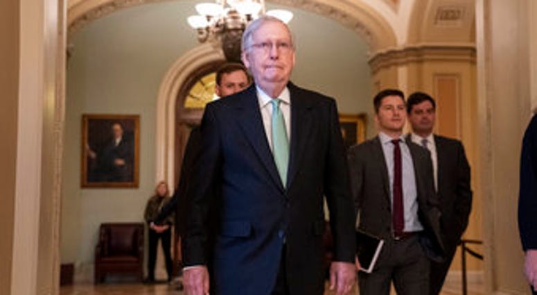 Senate Majority Leader Mitch McConnell, R-Ky., leaves the chamber after criticizing the House Democrats' effort to impeach President Donald Trump, at the Capitol in Washington, Tuesday, Dec. 17, 2019. (AP Photo/J. Scott Applewhite) Senate Majority Leader Mitch McConnell, R-Ky., leaves the chamber after criticizing the House Democrats' effort to impeach President Donald Trump, at the Capitol in Washington, Tuesday, Dec. 17, 2019. (AP Photo/J. Scott Applewhite)