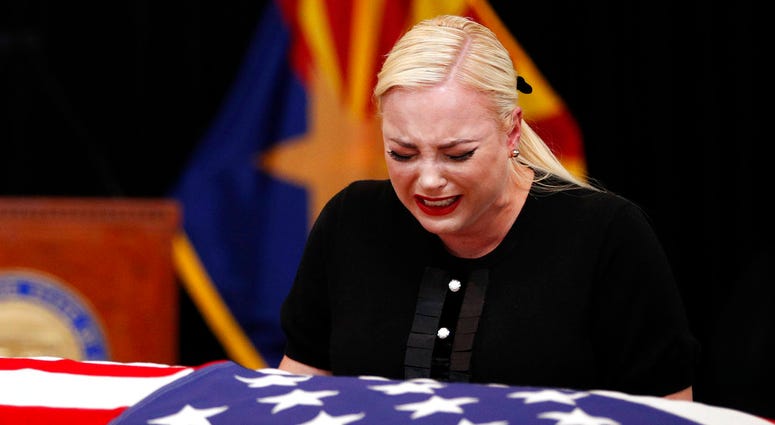 Meghan McCain, daughter of, Sen. John McCain, R-Ariz. cries at the casket of her father during a memorial service at the Arizona Capitol on Wednesday, Aug. 29, 2018, in Phoenix. (AP Photo/Jae C. Hong, Pool)