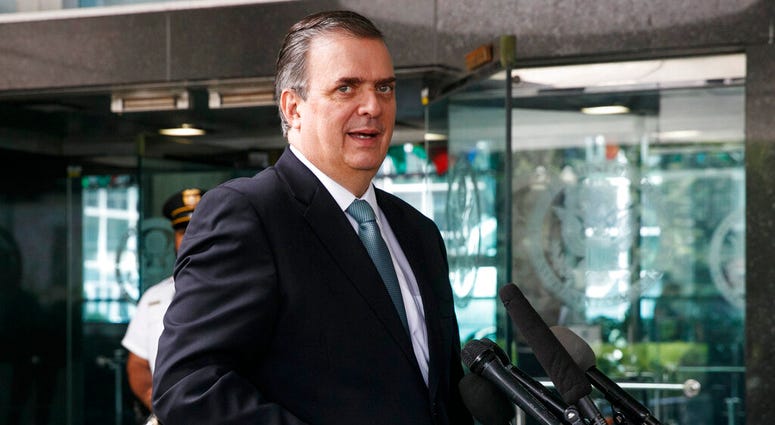 Marcelo Ebrard, Mexico's Secretary of Foreign Affairs, speaks to the media as he leaves a meeting about tariffs at the State Department, Thursday June 6, 2019, in Washington. (AP Photo/Jacquelyn Martin)