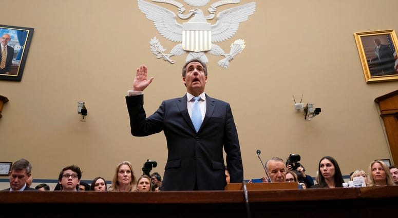 Michael Cohen, President Donald Trump's former personal lawyer, is sworn in to testify before the House Oversight and Reform Committee on Capitol Hill in Washington, Wednesday, Feb. 27, 2019. (AP Photo/J. Scott Applewhite)
