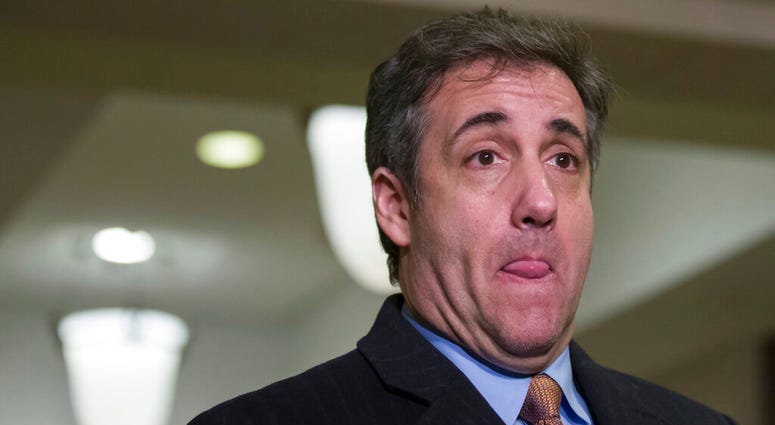 Michael Cohen, President Donald Trump's former lawyer, pauses while speaking as he departs after testifying before a closed-door session of the House Intelligence Committee on Capitol Hill, Wednesday, March 6, 2019, in Washington. (AP Photo/Alex Brandon)