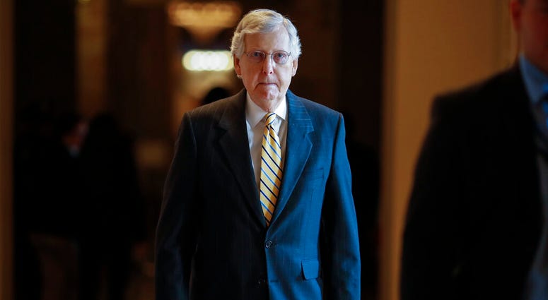 Senate Majority Leader Mitch McConnell, R-Ky., walks to the Senate chamber. (AP Photo/J. Scott Applewhite)