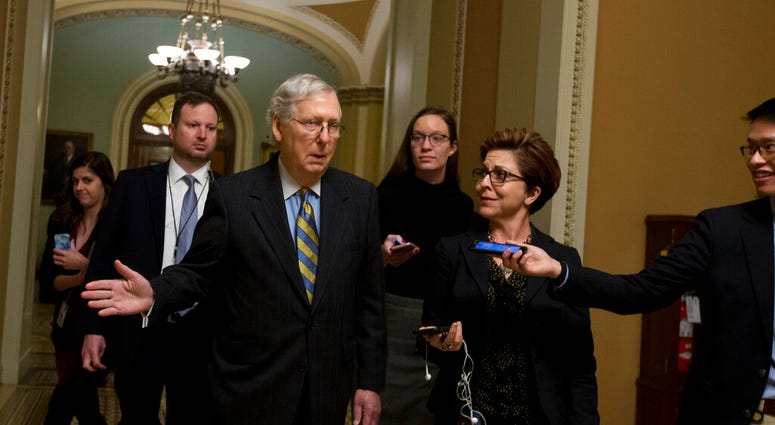 Senate Majority Leader Mitch McConnell, R-Ky., talks to reporters as leaves the senate chamber on Capitol Hill in Washington, Wednesday, Dec.18, 2019. (AP Photo/Jose Luis Magana) Senate Majority Leader Mitch McConnell, R-Ky., talks to reporters as leaves the senate chamber on Capitol Hill in Washington, Wednesday, Dec.18, 2019. (AP Photo/Jose Luis Magana)