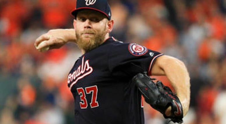 Washington Nationals starting pitcher Stephen Strasburg throws against the Houston Astros during the first inning of Game 6 of the baseball World Series Tuesday, Oct. 29, 2019, in Houston. (AP Photo/Mike Ehrmann, Pool)