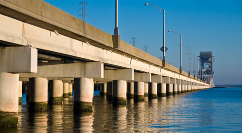 James River Bridge in Newport News, VA dividing deep blue water and sky