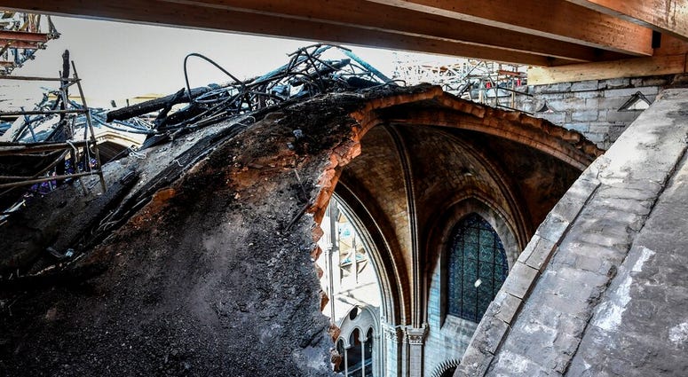 A hole is pictured at the Notre-Dame de Paris Cathedral three months after a major fire Wednesday, July 17, 2019 in Paris. (Stephane de Sakutin/Pool via AP)
