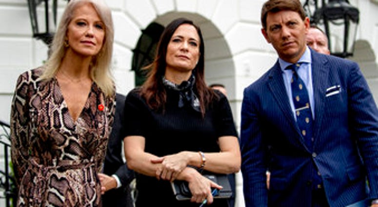 From left, counselor to the President Kellyanne Conway, White House press secretary Stephanie Grisham, and Deputy White House press secretary Hogan Gidley. (AP Photo/Andrew Harnik)