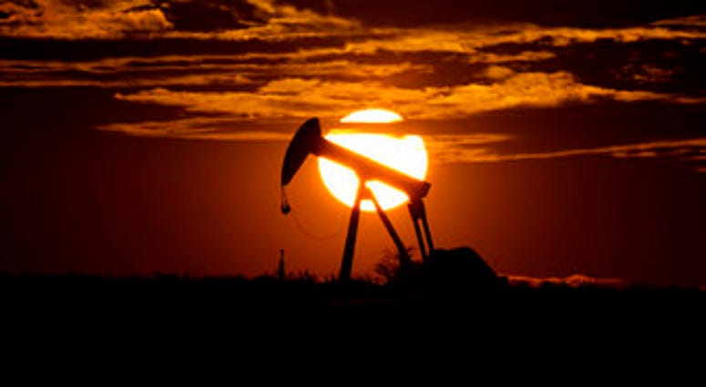 The sun sets behind an idle pump jack near Karnes City, Texas, Wednesday, April 8, 2020. Demand for oil continues to fall due to the new coronavirus outbreak. (AP Photo/Eric Gay) The sun sets behind an idle pump jack near Karnes City, Texas, Wednesday, April 8, 2020. Demand for oil continues to fall due to the new coronavirus outbreak. (AP Photo/Eric Gay)